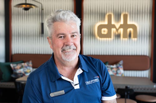 A photo of an estate agent called Brad who is happy with the care that DvH give to their clients